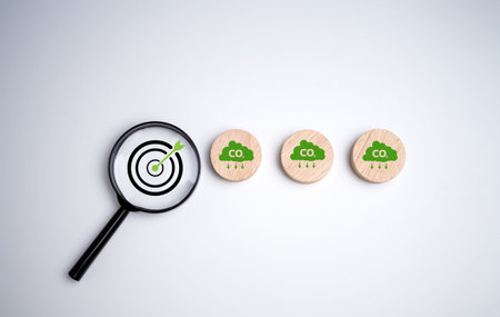 Net zero by 2050, Circle plank with green cloud icon and dartboard focus magnifying glass on white...