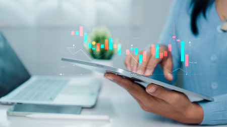 Businesswoman is showing a growing virtual hologram of analytics dashboard with charts, Stock...