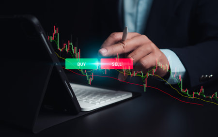 Investors use laptops to analyze stock market, investment strategies. and business growth analysis,...