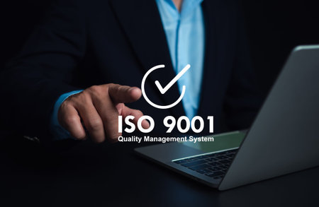 ISO 9001 Standard certification standardisation quality control concept. Businessman point your finger at text ISO 9001 for quality management of organizations, Certified and quality.の写真素材