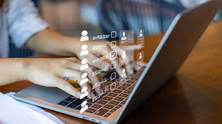 Human resource manager checks the CV online to choose the perfect employee for his business, Online and modern technologies for simplifying the human resources system, HR technology.の写真素材