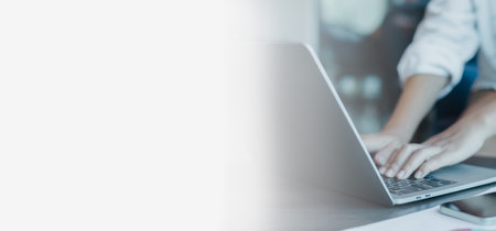 Free space for text and advertising, Person typing on laptop keyboard.の写真素材