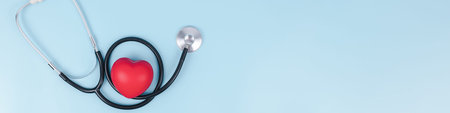 Stethoscope and red hearts on light blue background, Health care concept, Hospital life insurance...