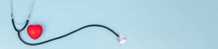 Stethoscope and red hearts on light blue background, Health care concept,  World heart health day, Doctor day, Hospital life insurance concept, World hypertension day.の写真素材