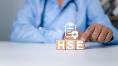 HSE, Health safety environment concept, Standard safe industrial work and industrial, Doctor hand choose HSE text show consideration for work safety, Safety and protection in industrial work.の写真素材