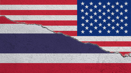 USA and Thailand flags on cracked concrete background, USA and Thailand trade war, USA and Thailand trade relations, Trade war symbols, Tariff barriers between US and Thailand, Tax war.の写真素材