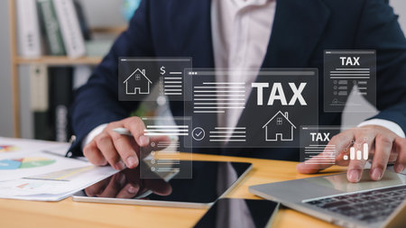Tax documents and savings, Corporate and individual tax payment concept, VAT of business, Submit request refund tax, Businessman using computer filling out corporate and personal income tax return.の写真素材