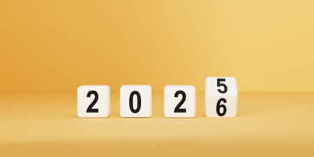 Business vision, financial planning, and marketing strategy. White cube flips from 2025 to 2026 on yellow floor, symbolizing fresh starts, planning, and strategy. Perfect for themeの写真素材