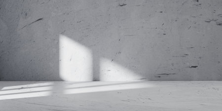 Minimalist concrete interior with dramatic light and shadow contrast. Perfect abstract and architectural background for design mockups, branding visuals, or modern presentation templates.の写真素材