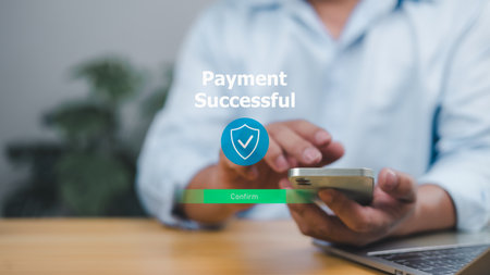 Successful secure online payment on a mobile device, symbolizing trusted digital transactions, mobile banking, and e-commerce. Ideal for financial technology, secure shopping, and digital wallets.の写真素材