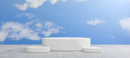 3D white cylindrical product display podiums of varying sizes on a concrete surface, set against a bright blue sky with wispy clouds, Multi-product showcases, advertising, and creative presentations.の写真素材