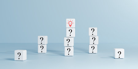 Minimalist white cubes with question marks surround one red light bulb cube in the center. Symbolizing problem-solving, ideas, challenges, creative solutions. Perfect for business strategy, innovationの写真素材