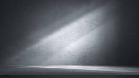 Dramatic grey concrete wall and floor with diagonal light beam, perfect for abstract product background, industrial showcase, or minimalist presentation.の写真素材