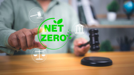 Net zero and climate law concept showing a judge with gavel and legal icons, symbolizing...