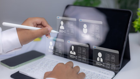 Recruitment technology, Concept of online hiring, human resources, and digital employment process. Businessman reviewing digital resumes on virtual screen using stylus and tablet.の写真素材