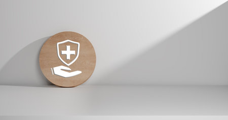3D render of a healthcare and medical shield symbol. a clean white wall with dynamic lighting and shadows. This symbolizes protection, health insurance, security, and well being.の写真素材