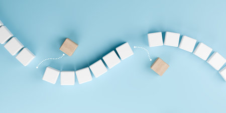 3D render of wooden and white cubes with arrows on blue background, symbolizing business innovation, transformation, change management, leadership strategy and creative problem solving.の写真素材