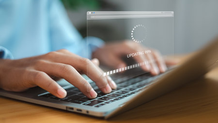 Person typing on laptop with software update progress bar. Concept of system maintenance, technology upgrade, data security, and digital innovation.の写真素材