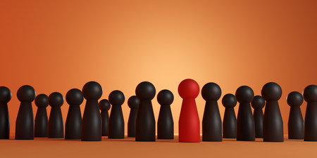 Red pawn standing out from black crowd on orange background. Concept of leadership, individuality, uniqueness, and standing out in business or teamwork.の写真素材
