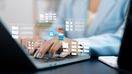 Business person using laptop with digital file folders hologram, representing cloud storage, data...