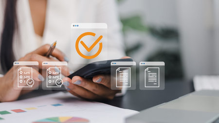 Businesswoman using smartphone for digital document management and task approval. Concept of online...