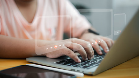 Hands typing on laptop with digital video call icons, online meeting and communication interface,...