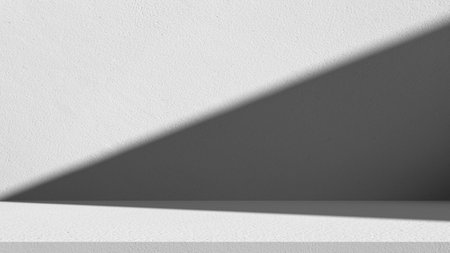 Minimal white wall background with diagonal shadow and light texture, perfect for design presentation, product display, or modern abstract concept.の写真素材
