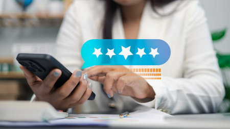 Hands using smartphone with floating five-star rating and feedback interface, representing customer...