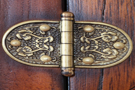 Close up of a wooden cupboard hook lock.