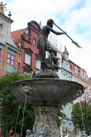 Neptune Fountain and the Townhall in Gdansk Polandの写真素材