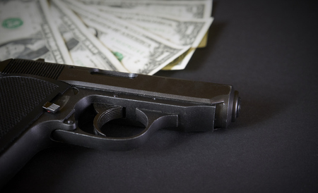 Gun and money conceptの写真素材