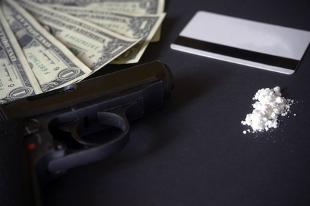 Credit card, gun, road of cocacine. drug powderの写真素材