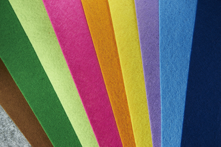 Colored felt texture background, grey, brrown, green, lime, pink, orange, yellow, purple, light blue, dark plueの写真素材
