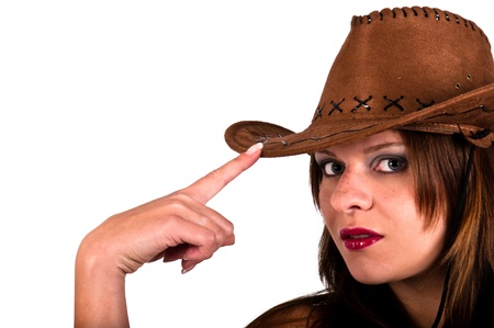 sexy young cowgirl tapping her hat の写真素材