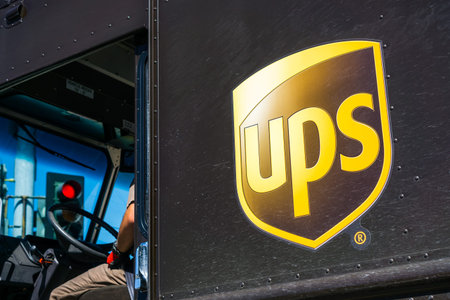 Santa Clara / CA / USA - Close up of UPS logo printed on a delivery truck; partial view of the...