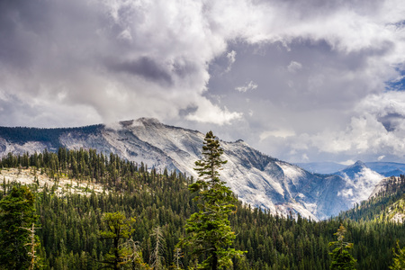 View towards Clouds' Rest summit in Yosemite National Park, dramatic clouds covering the sky; Californiaの写真素材