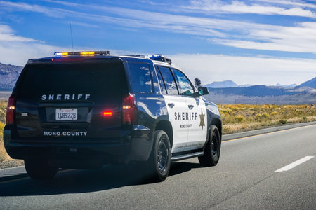 September 29, 2018 Lee Vining / CA / USA - Mono County Sheriff Police car driving on highway 395, Eastern Sierra mountainsのeditorial素材