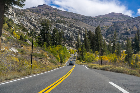 Driving through the Sierra mountains towards Sonora pass on a sunny autumn day, Californiaの写真素材