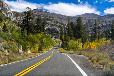 Driving through the Sierra mountains towards Sonora pass on a sunny autumn day, Californiaの写真素材