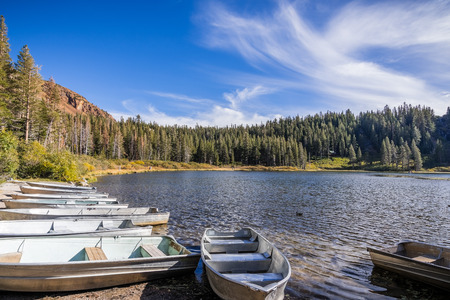 Boats on the shore of Lake George in the Mammoth Lakes Basin, Eastern Sierra mountains, Californiaの写真素材