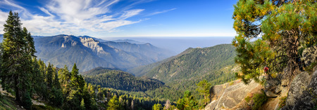 Landscape in Sequoia National Park in Sierra Nevada mountains on a sunny day; smoke from wildfires visible in the background, covering the Fresno area;の写真素材