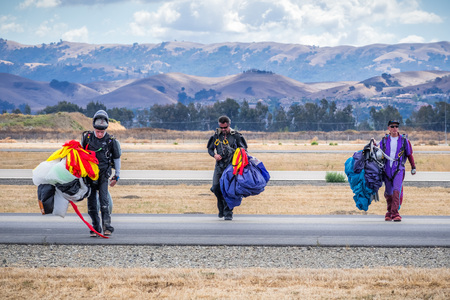 October 6, 2018 Livermore / CA / USA - Team of parachutists after landing a jump; Livermore Municipal Airport Open House event; east San Francisco bay areaのeditorial素材