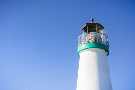 Top of the Santa Cruz Breakwater Lighthouse, Walton Lighthouse, Santa Cruz, California; blue sky backgroundの写真素材