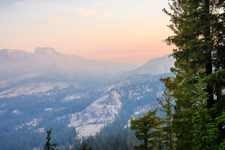 Sunrise landscape in Yosemite National Park; low visibility due to the smoke from the Ferguson Fire present in the air; Californiaの写真素材