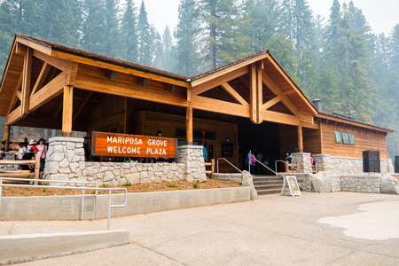 July 17, 2018 Fish Camp / CA / USA - The Entrance to the new Mariposa Grove Welcome Plaza building in Yosemite National Park; Smoke from Ferguson Fire visible in the air and covering the skyのeditorial素材
