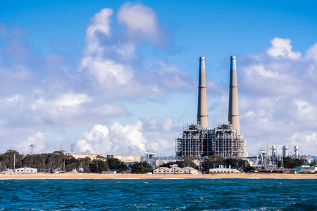 Power generating facilities and other industrial buildings on the Pacific Ocean coastline, Moss Landing, Monterey Bay, Californiaの写真素材