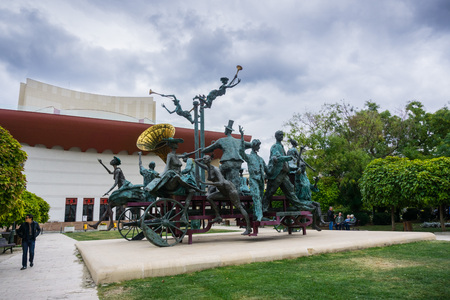 September 22, 2017 Bucharest/Romania - "A Carriage with Clowns" (Caruta cu Paiate) sculpture by Ioan Bolborea in front of the Ion Luca Caragiale National Theater of Bucuresti (TNB), Romania.のeditorial素材