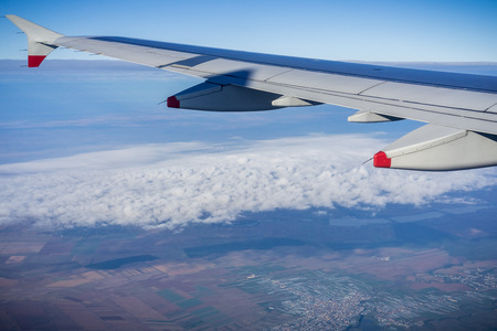 Window view of flying over the Romanian countryside after taking off from Bucharest, Romaniaの写真素材