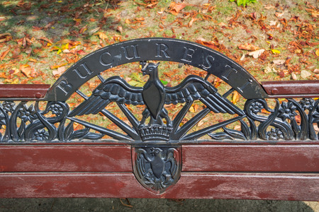 September 19, 2017 Bucharest/Romania - Park bench in Herastrau decorated with the city's name and coat of armsのeditorial素材