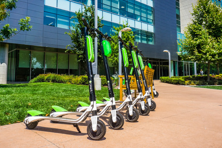 August 9, 2018 Mountain View / CA / USA - Lime Scooters lined up at the LimeHub in the Samsung campus in Silicon Valley, south San Francisco bay areaのeditorial素材